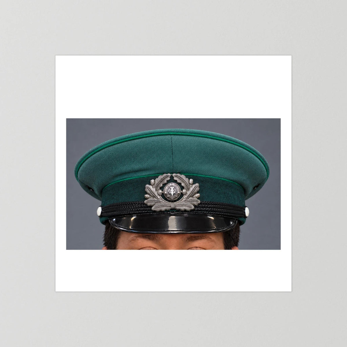East German Volkpolizei (People's Police), Visor Cap, January 1989 — photograph presentation mockup