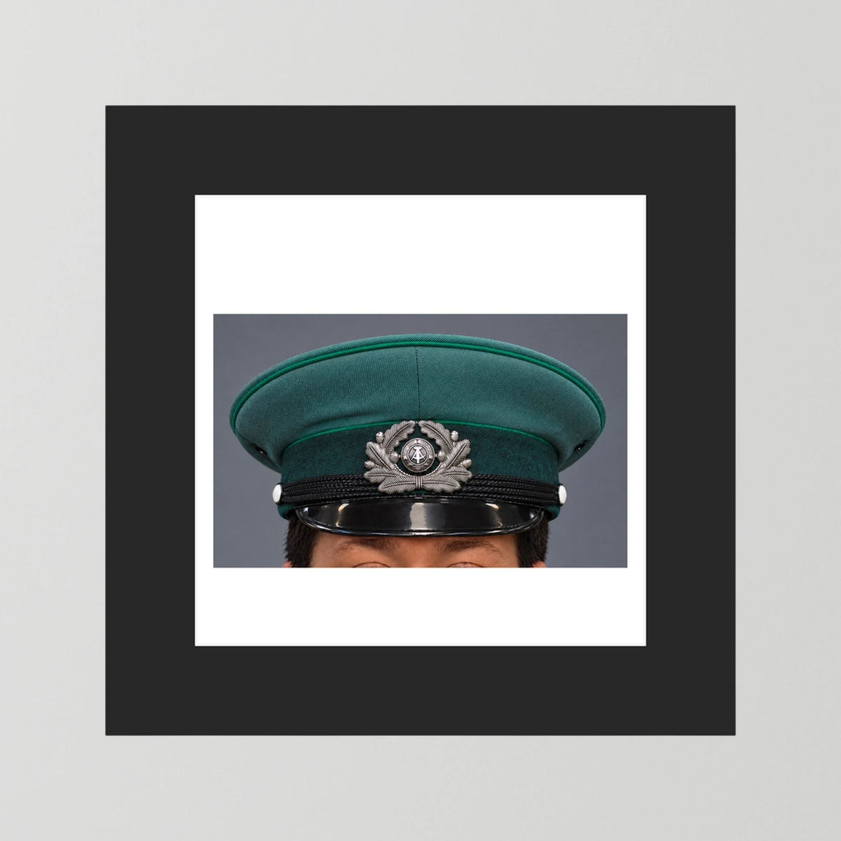 East German Volkpolizei (People's Police), Visor Cap, January 1989 — photograph presentation mockup
