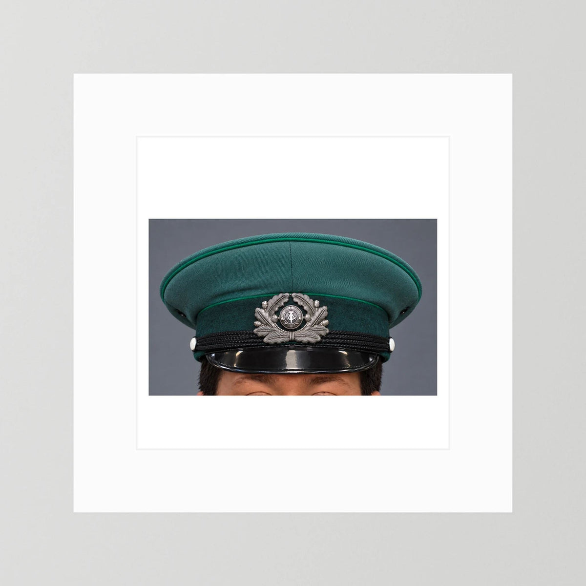 East German Volkpolizei (People's Police), Visor Cap, January 1989 — photograph presentation mockup