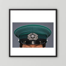 East German Volkpolizei (People's Police), Visor Cap, January 1989 — photograph displayed in a black wood frame mockup