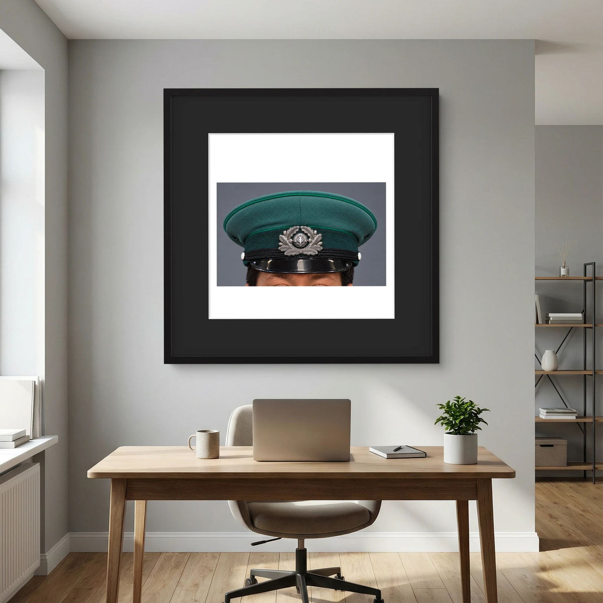 East German Volkpolizei (People's Police), Visor Cap, January 1989 — photograph displayed in a black wood frame mockup