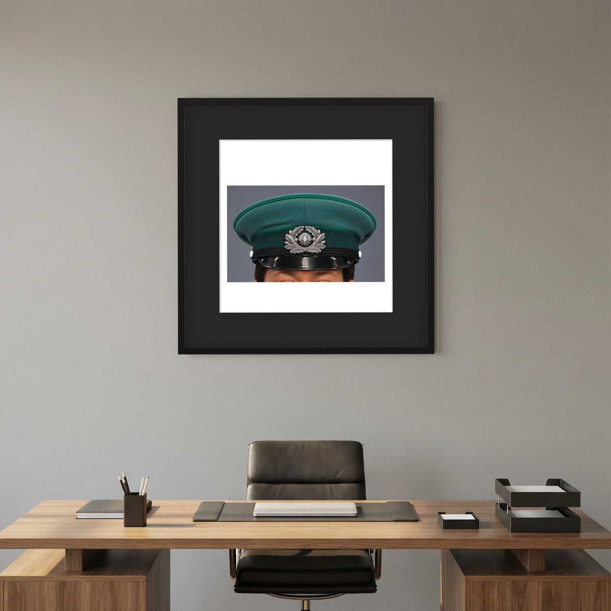 East German Volkpolizei (People's Police), Visor Cap, January 1989 — photograph displayed in a black wood frame mockup