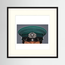 East German Volkpolizei (People's Police), Visor Cap, January 1989 — photograph displayed in a black wood frame mockup