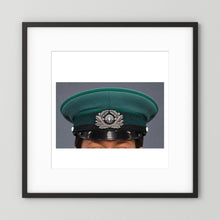 East German Volkpolizei (People's Police), Visor Cap, January 1989 — photograph displayed in a black wood frame mockup