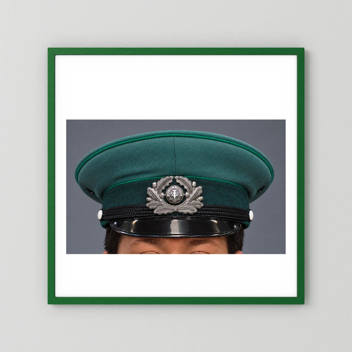 East German Volkpolizei (People's Police), Visor Cap, January 1989 — photograph presentation mockup