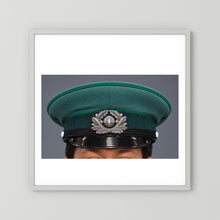 East German Volkpolizei (People's Police), Visor Cap, January 1989 — photograph displayed in a white wood frame mockup