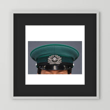 East German Volkpolizei (People's Police), Visor Cap, January 1989 — photograph displayed in a white wood frame mockup