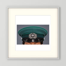 East German Volkpolizei (People's Police), Visor Cap, January 1989 — photograph displayed in a white wood frame mockup