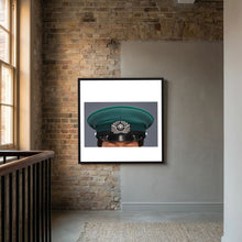 East German Volkpolizei (People's Police), Visor Cap, January 1989 — photograph displayed in a white wood frame mockup