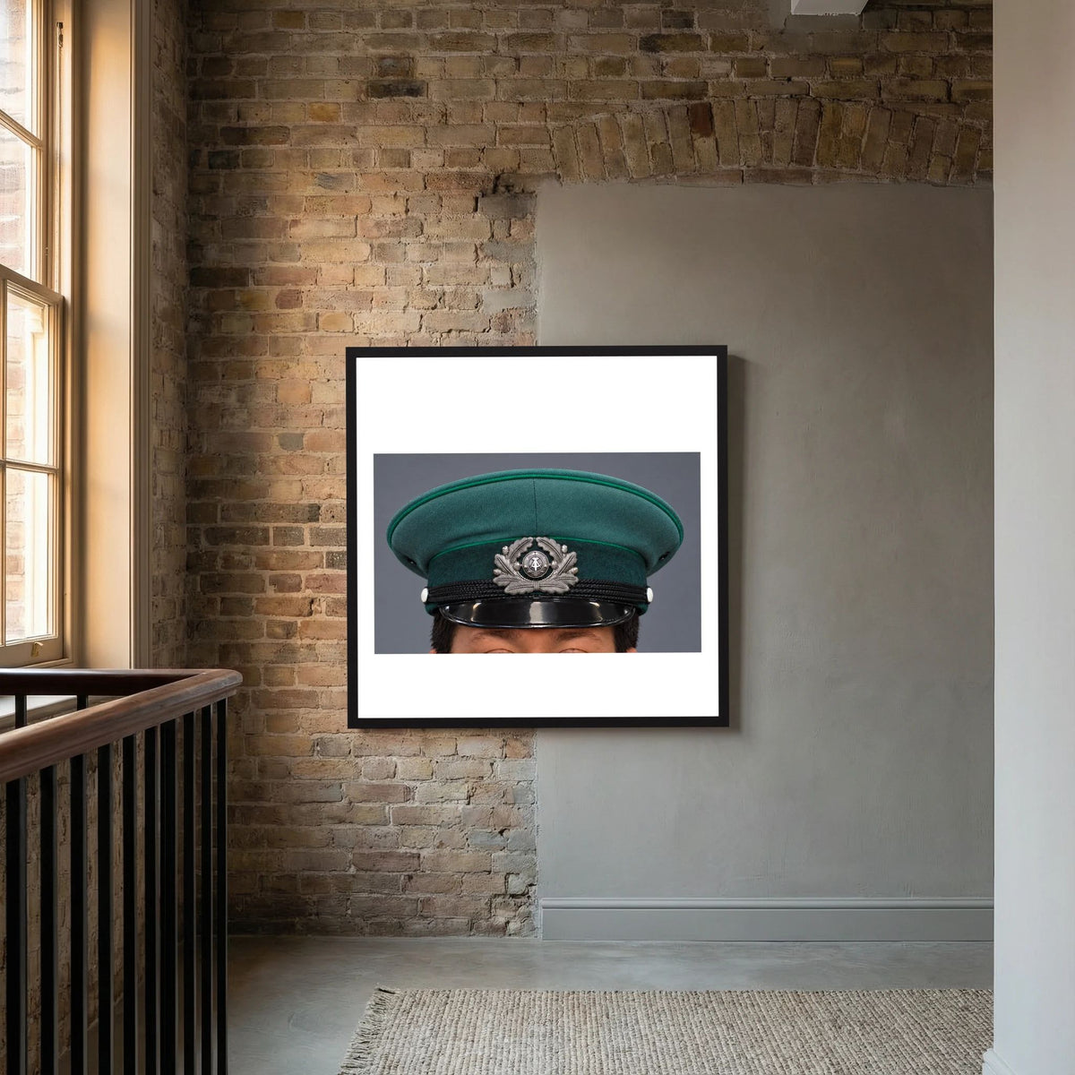 East German Volkpolizei (People's Police), Visor Cap, January 1989 — photograph displayed in a white wood frame mockup