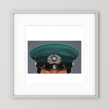 East German Volkpolizei (People's Police), Visor Cap, January 1989 — photograph displayed in a white wood frame mockup