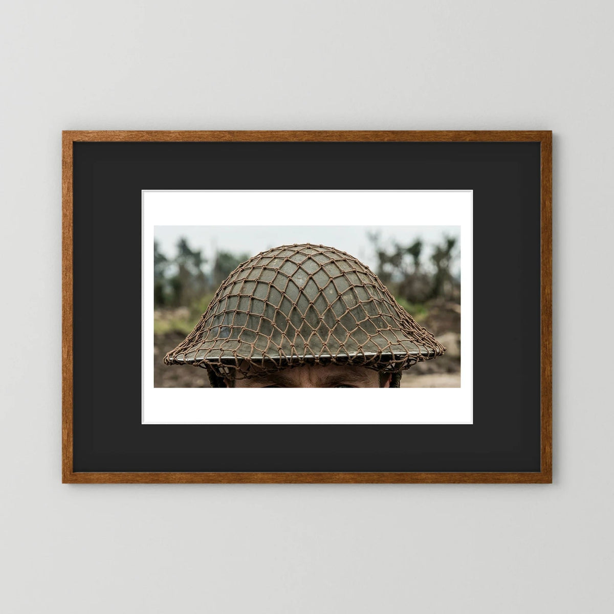 Mk II Brodie Helmet WW2 British Armed Forces. All ranks — photograph displayed in a black wood frame mockup