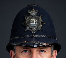 Photograph of Police Helmet "Bobby." Hertfordshire Constabulary, United Kingdom. British