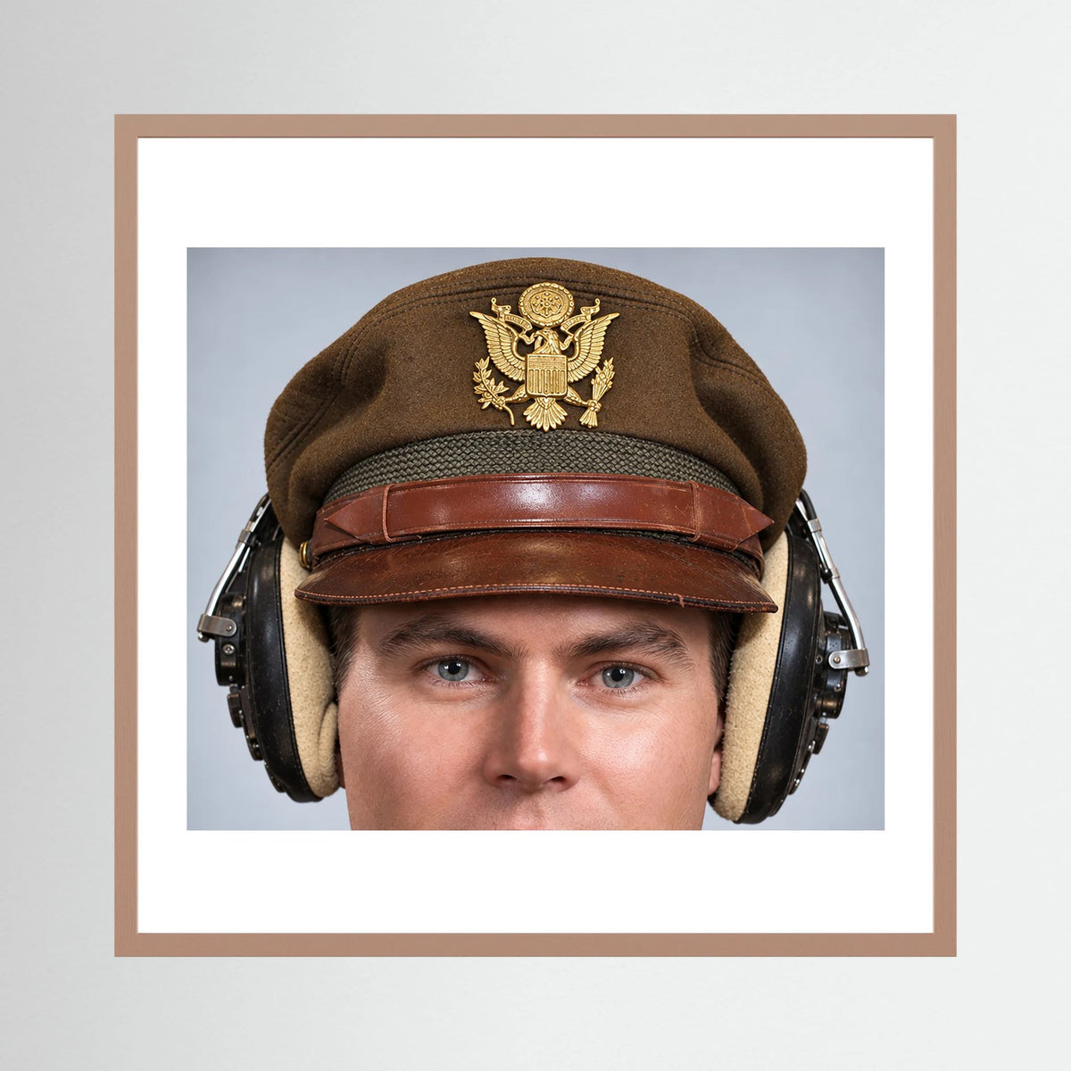 US Army Air Force WW2 Crusher Caps with headphones. Temperate Cover — photograph displayed in a black wood frame mockup