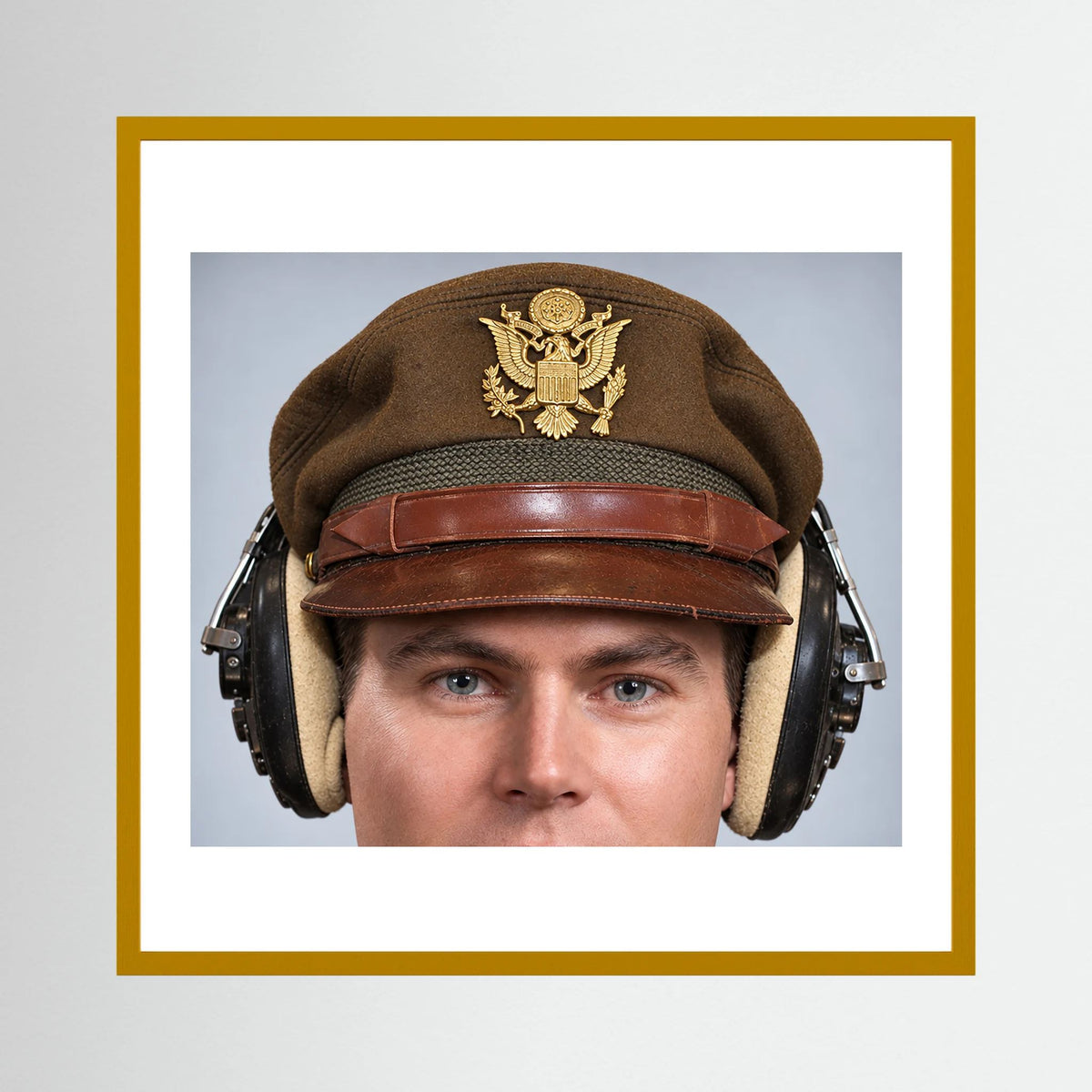 US Army Air Force WW2 Crusher Caps with headphones. Temperate Cover — photograph displayed in a black wood frame mockup