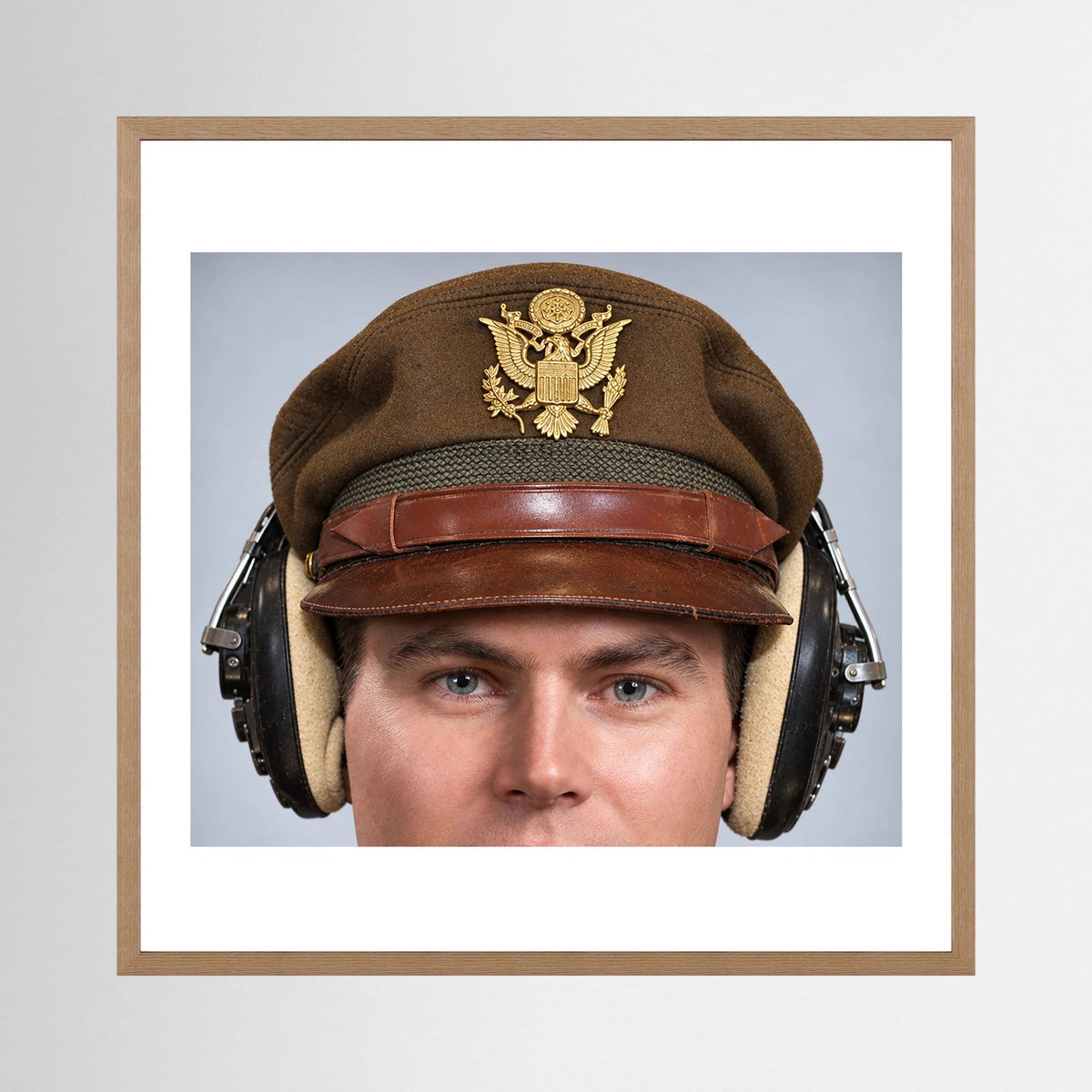 US Army Air Force WW2 Crusher Caps with headphones. Temperate Cover — photograph displayed in a black wood frame mockup
