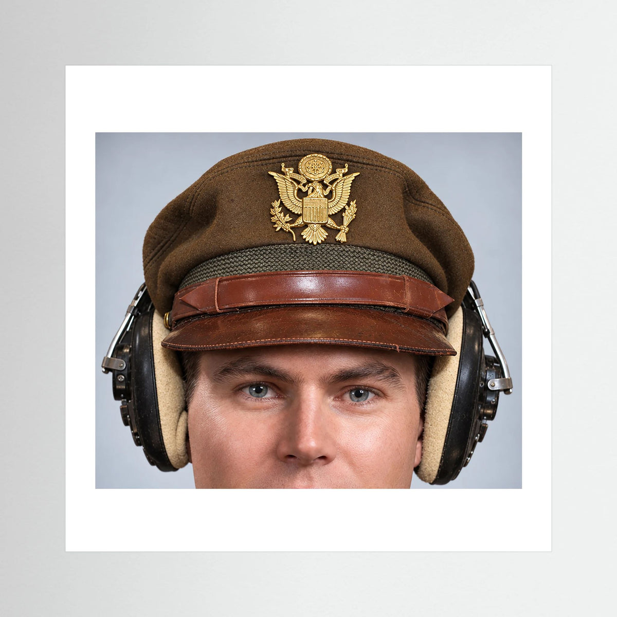 US Army Air Force WW2 Crusher Caps with headphones. Temperate Cover — photograph displayed in a black wood frame mockup
