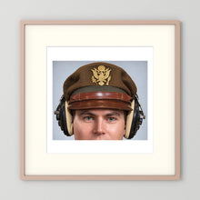 US Army Air Force WW2 Crusher Caps with headphones. Temperate Cover — photograph displayed in a black wood frame mockup