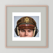 US Army Air Force WW2 Crusher Caps with headphones. Temperate Cover — photograph displayed in a black wood frame mockup