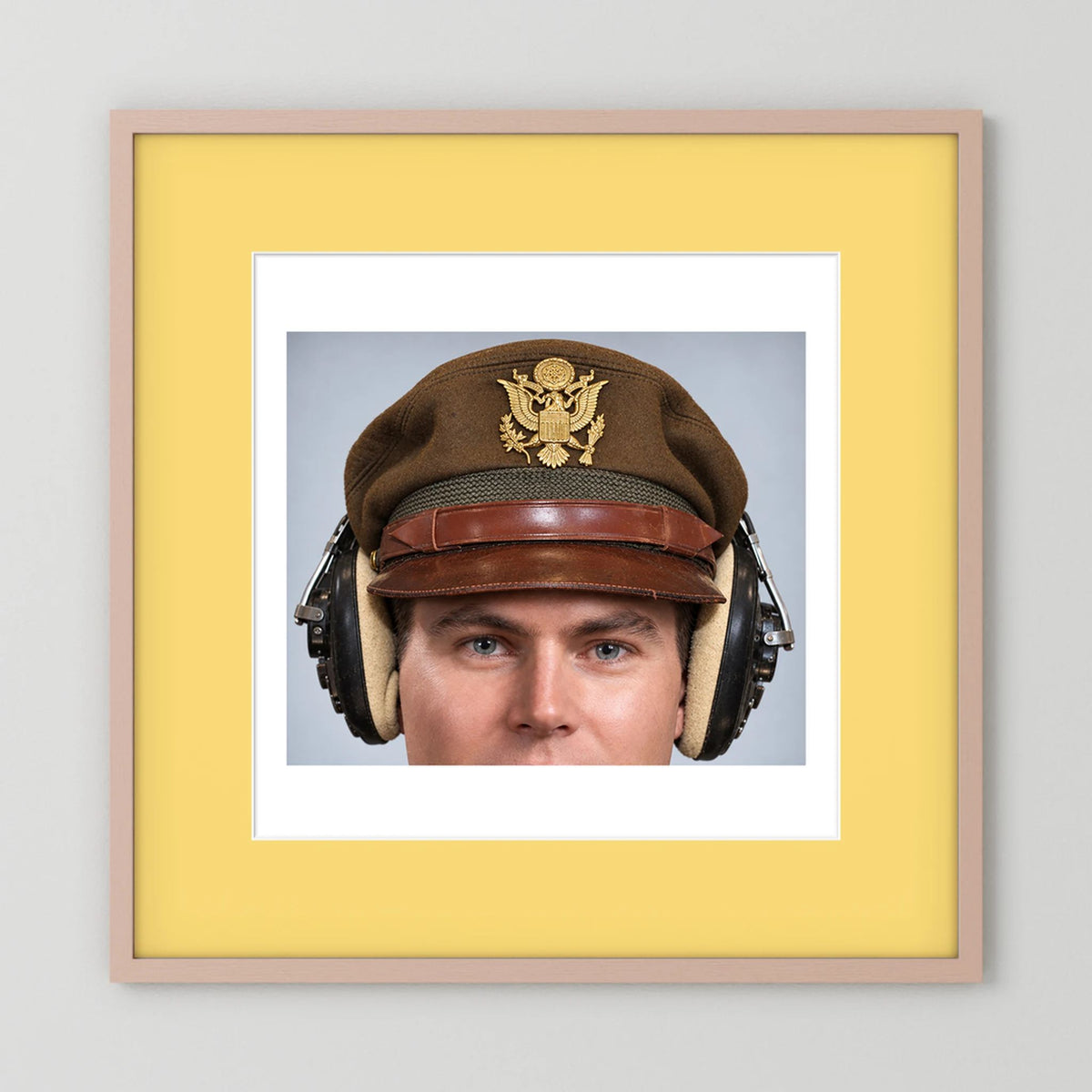 US Army Air Force WW2 Crusher Caps with headphones. Temperate Cover — photograph displayed in a black wood frame mockup