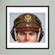 US Army Air Force WW2 Crusher Caps with headphones. Temperate Cover — photograph displayed in a black wood frame mockup