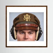 US Army Air Force WW2 Crusher Caps with headphones. Temperate Cover — photograph displayed in a black wood frame mockup