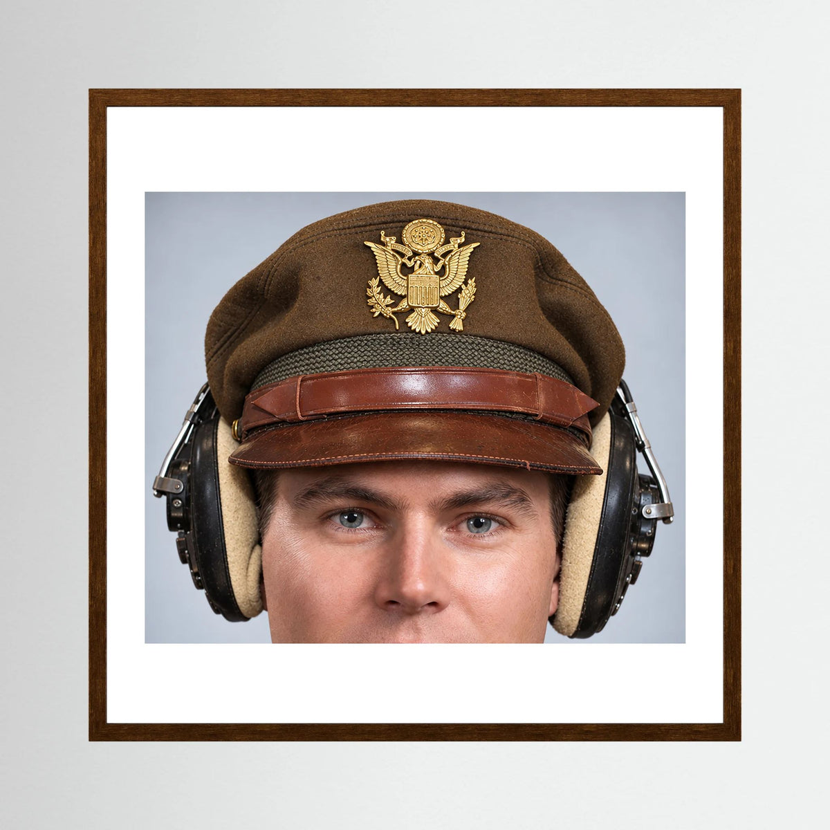 US Army Air Force WW2 Crusher Caps with headphones. Temperate Cover — photograph displayed in a black wood frame mockup