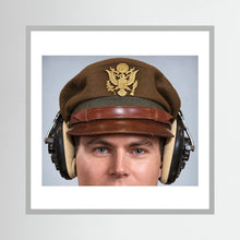 US Army Air Force WW2 Crusher Caps with headphones. Temperate Cover — photograph displayed in a black wood frame mockup