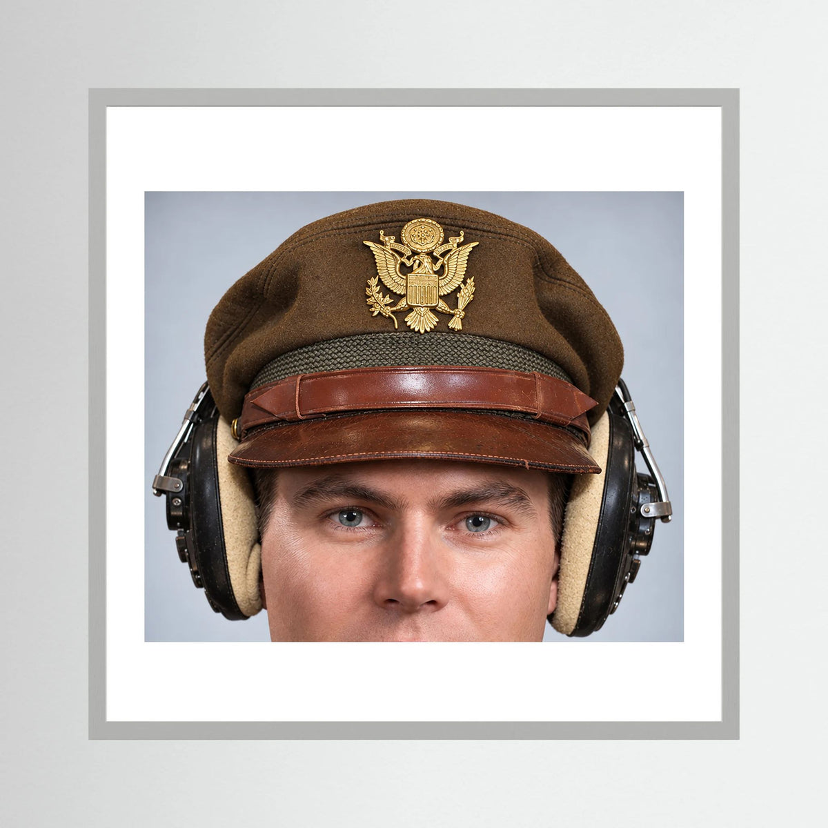 US Army Air Force WW2 Crusher Caps with headphones. Temperate Cover — photograph displayed in a black wood frame mockup