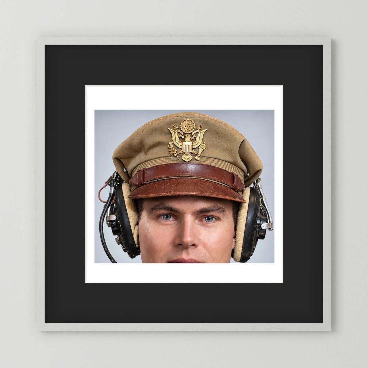 US Army Air Force WW2 Crusher Caps with headphones. Tropical Cover — photograph displayed in a black wood frame mockup