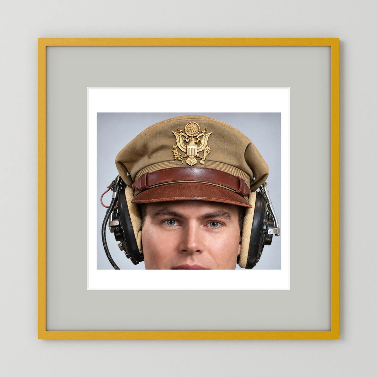 US Army Air Force WW2 Crusher Caps with headphones. Tropical Cover — photograph displayed in a black wood frame mockup