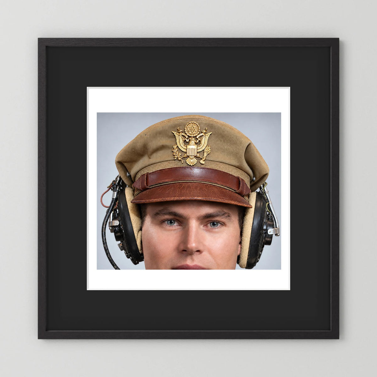 US Army Air Force WW2 Crusher Caps with headphones. Tropical Cover — photograph displayed in a black wood frame mockup