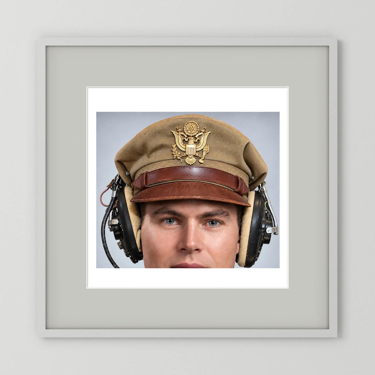 US Army Air Force WW2 Crusher Caps with headphones. Tropical Cover — photograph displayed in a black wood frame mockup