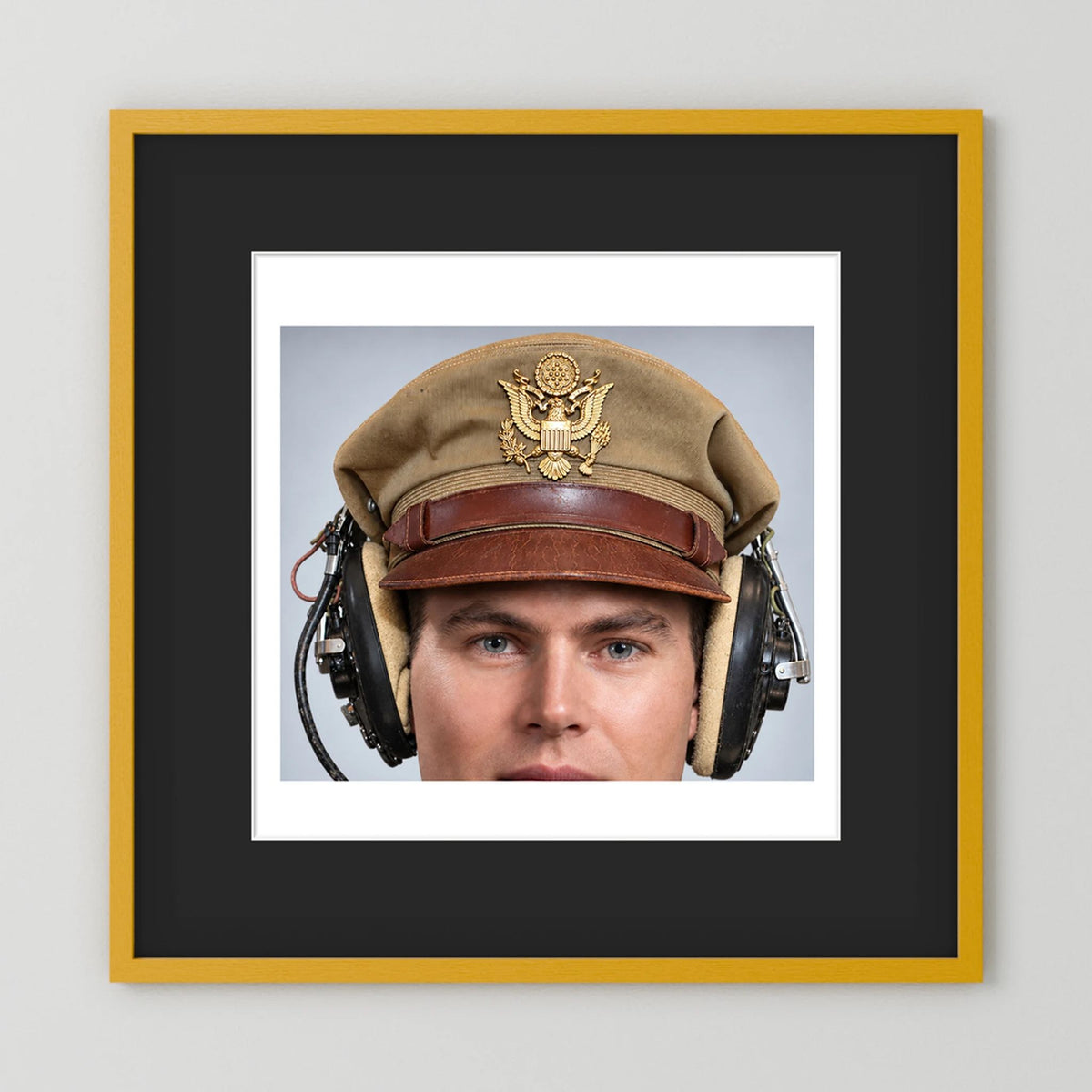 US Army Air Force WW2 Crusher Caps with headphones. Tropical Cover — photograph displayed in a black wood frame mockup