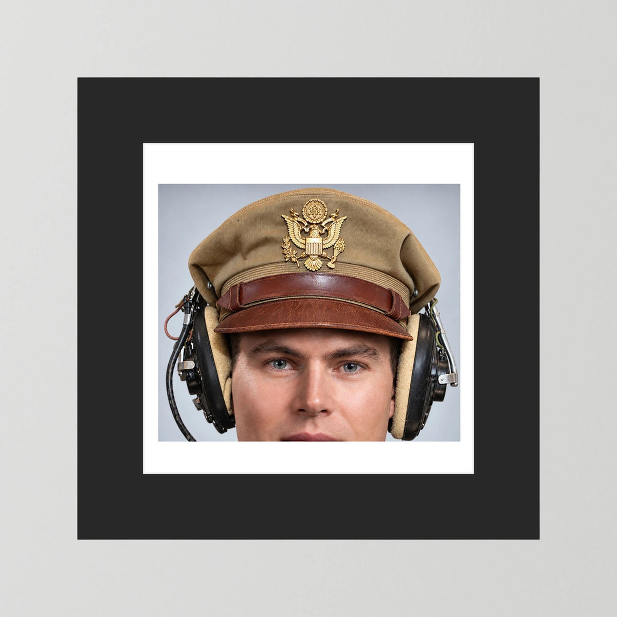 US Army Air Force WW2 Crusher Caps with headphones. Tropical Cover — photograph displayed in a black wood frame mockup