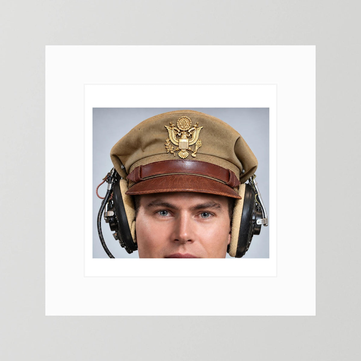 US Army Air Force WW2 Crusher Caps with headphones. Tropical Cover — photograph displayed in a black wood frame mockup