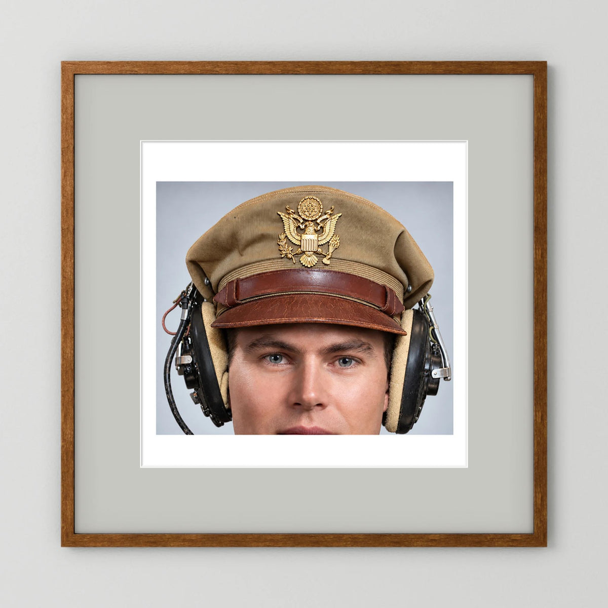 US Army Air Force WW2 Crusher Caps with headphones. Tropical Cover — photograph displayed in a black wood frame mockup