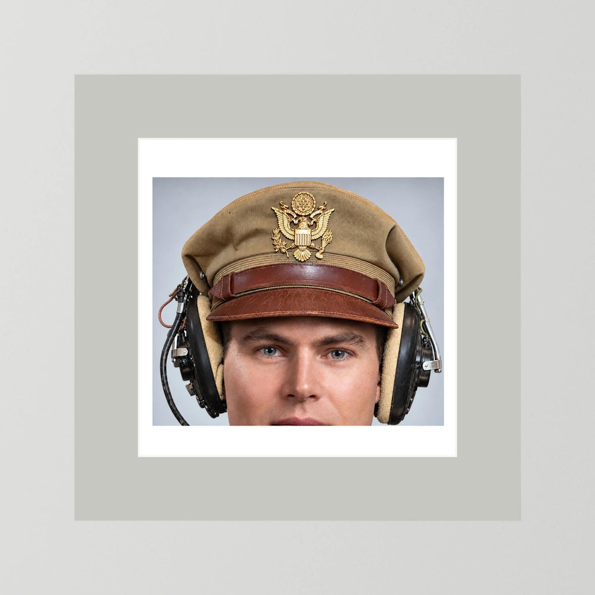 US Army Air Force WW2 Crusher Caps with headphones. Tropical Cover — photograph displayed in a black wood frame mockup