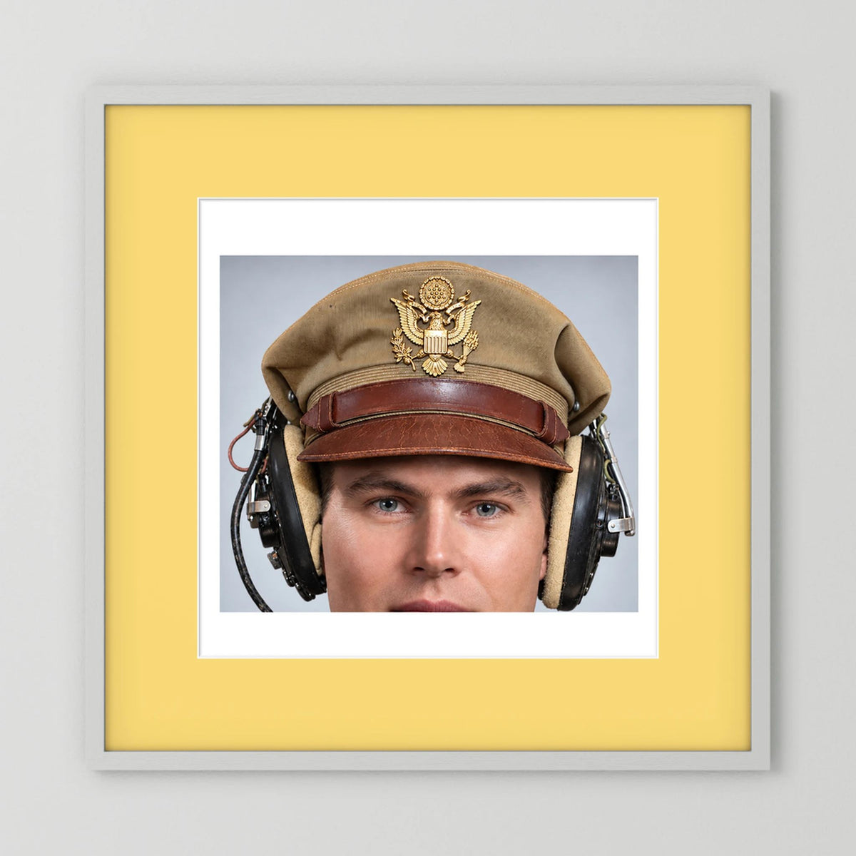US Army Air Force WW2 Crusher Caps with headphones. Tropical Cover — photograph displayed in a black wood frame mockup