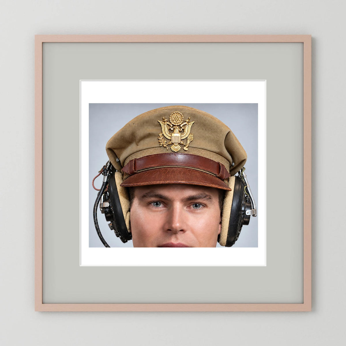 US Army Air Force WW2 Crusher Caps with headphones. Tropical Cover — photograph displayed in a black wood frame mockup