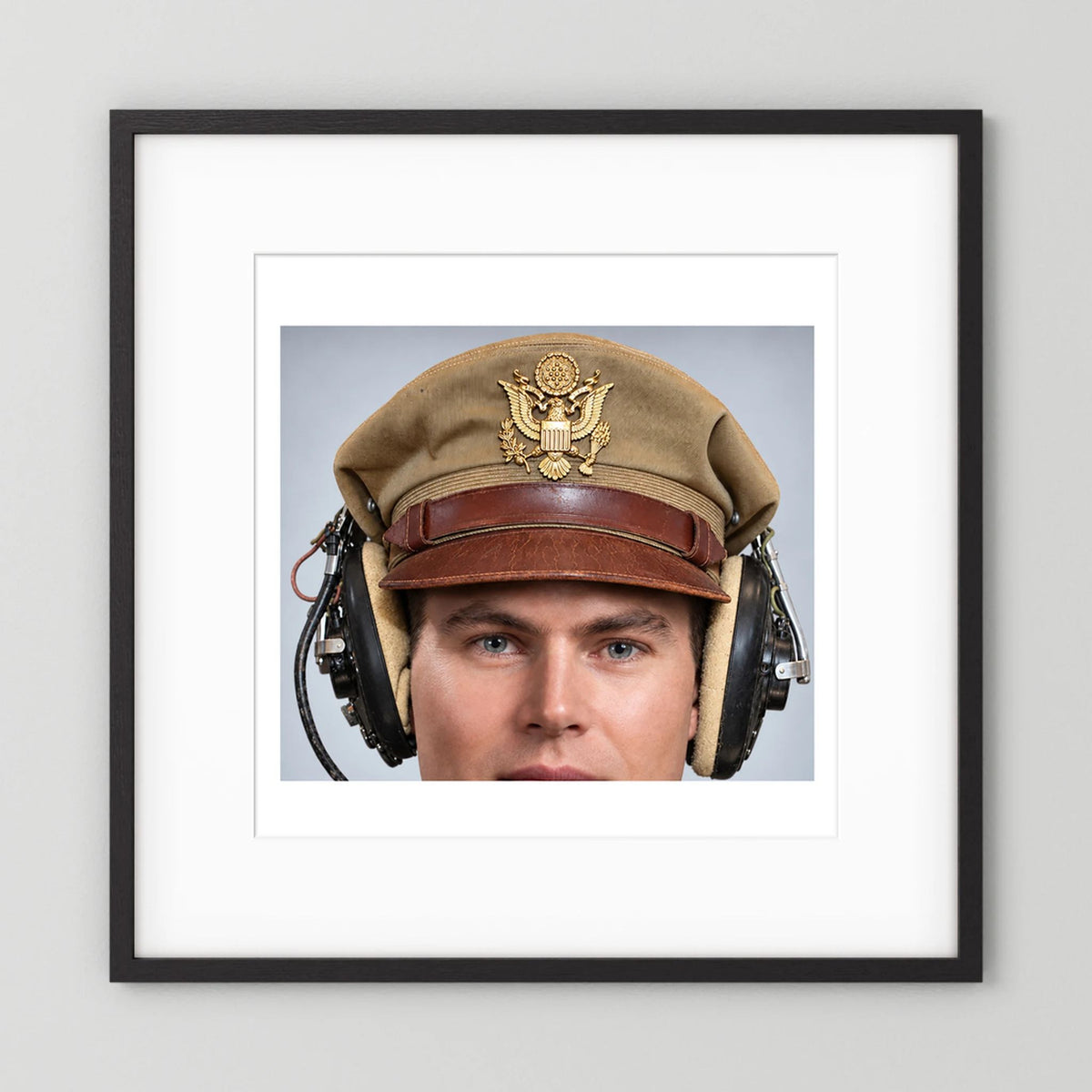 US Army Air Force WW2 Crusher Caps with headphones. Tropical Cover — photograph displayed in a black wood frame mockup